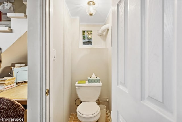 bathroom featuring toilet and ornamental molding