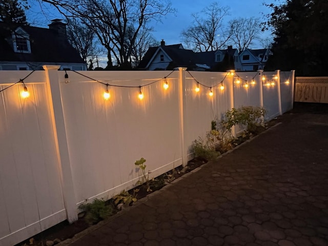 view of side of property featuring fence