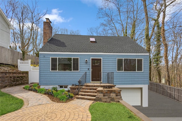 37 Soundview Rd, Huntington, NY 11743 - view of front of home featuring a shingled roof, a garage, a chimney, and driveway