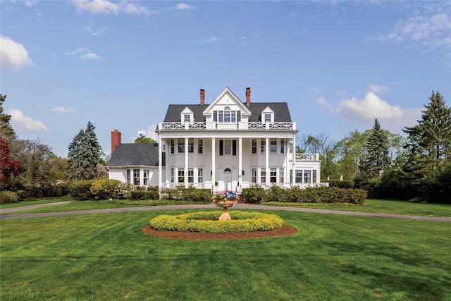 35 S Penataquit Ave, Bay Shore, NY 11706 - neoclassical / greek revival house with a front lawn and a chimney
