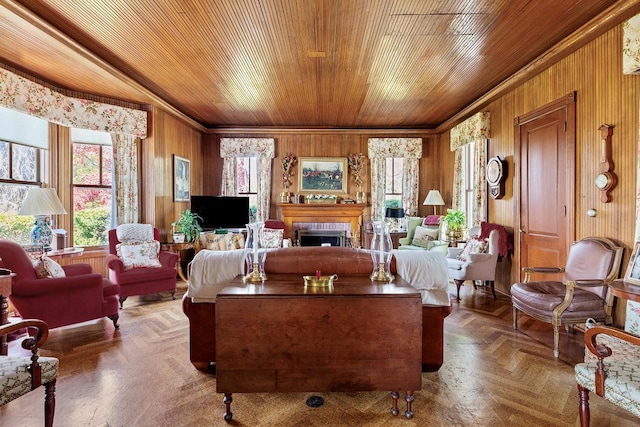 35 S Penataquit Ave, Bay Shore, NY 11706 - living room featuring wood walls, wood ceiling, ornamental molding, and a fireplace