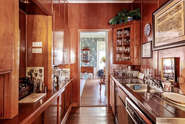 35 S Penataquit Ave, Bay Shore, NY 11706 - kitchen with brown cabinets, dark wood-style floors, dishwasher, glass insert cabinets, and wallpapered walls