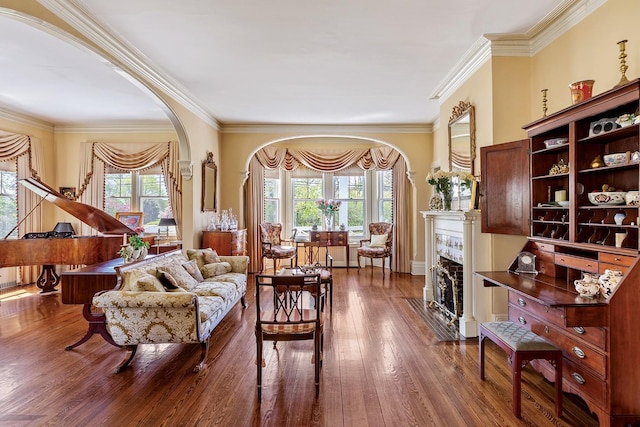 35 S Penataquit Ave, Bay Shore, NY 11706 - living area featuring arched walkways, a fireplace with flush hearth, hardwood / wood-style floors, and crown molding