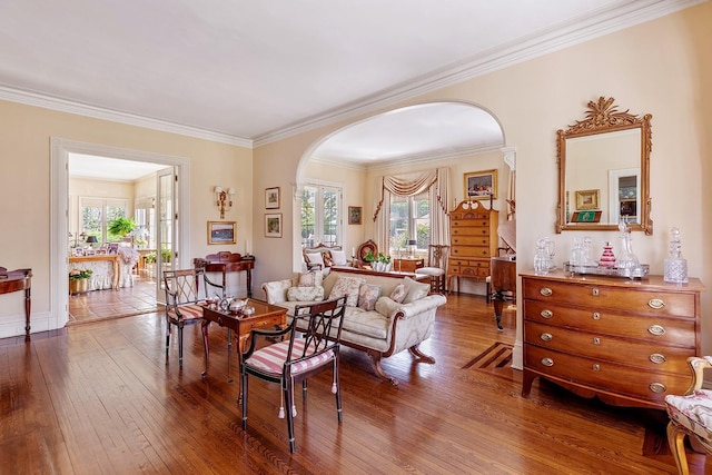 35 S Penataquit Ave, Bay Shore, NY 11706 - living area featuring arched walkways, dark wood-style flooring, crown molding, and baseboards