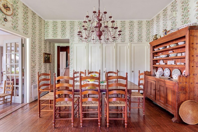 35 S Penataquit Ave, Bay Shore, NY 11706 - dining room featuring wallpapered walls, dark wood-style floors, crown molding, and a chandelier