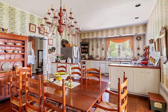 35 S Penataquit Ave, Bay Shore, NY 11706 - dining space featuring wallpapered walls, dark wood finished floors, a chandelier, and a barn door
