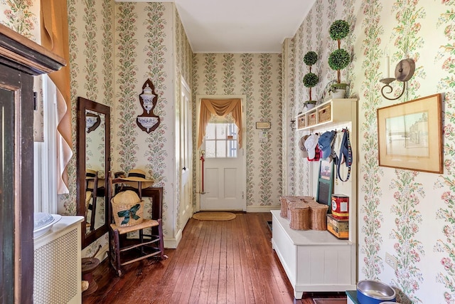 35 S Penataquit Ave, Bay Shore, NY 11706 - entrance foyer featuring hardwood / wood-style flooring, wallpapered walls, and baseboards
