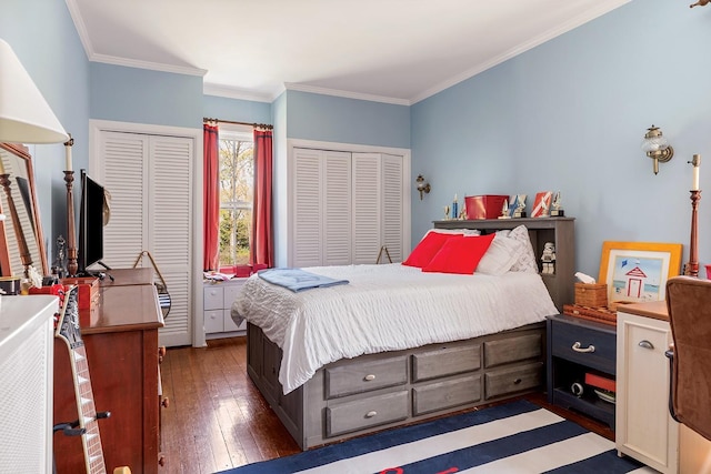 35 S Penataquit Ave, Bay Shore, NY 11706 - bedroom featuring hardwood / wood-style flooring, multiple closets, and crown molding