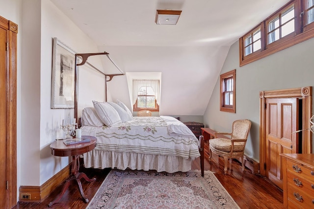 35 S Penataquit Ave, Bay Shore, NY 11706 - bedroom with dark wood-style flooring, baseboards, and vaulted ceiling