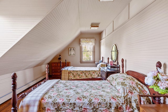 35 S Penataquit Ave, Bay Shore, NY 11706 - bedroom with lofted ceiling, a baseboard heating unit, and wood finished floors