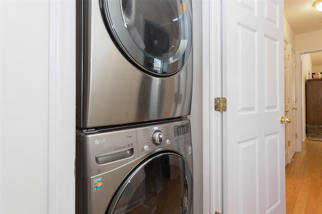 121-10 Powells Cove Blvd Unit C, College Point, NY 11356 - laundry area featuring stacked washer / drying machine and light wood-type flooring