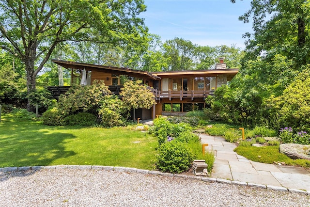 280 Salem Rd, Pound Ridge, NY 10576 - rear view of house with a lawn, a chimney, and a deck