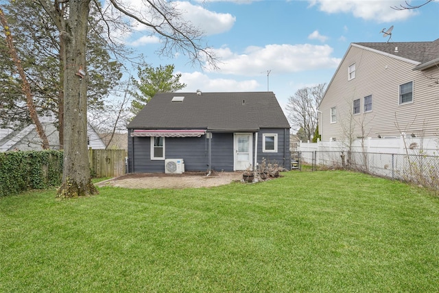 back of house featuring a yard, a fenced backyard, ac unit, and a patio