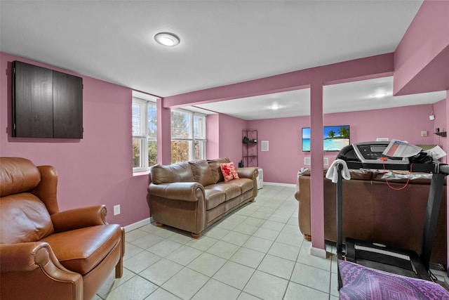 living room with baseboards and light tile patterned floors
