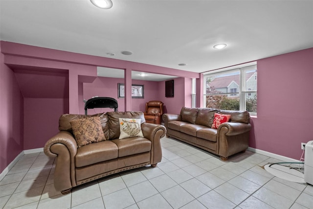 living area featuring light tile patterned flooring, recessed lighting, and baseboards