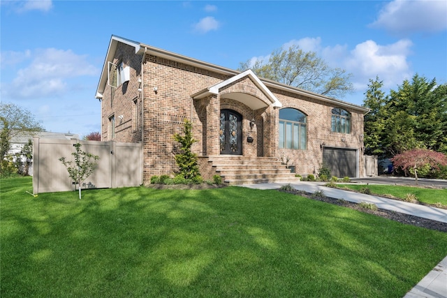 783 Oakleigh Rd, North Woodmere, NY 11581 - view of front of home featuring a garage, brick siding, aphalt driveway, and a front yard