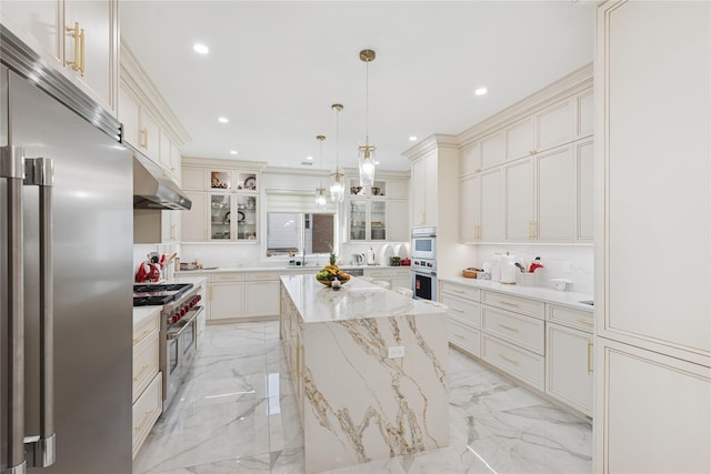 783 Oakleigh Rd, North Woodmere, NY 11581 - kitchen with a center island, premium appliances, marble finish floor, under cabinet range hood, and recessed lighting