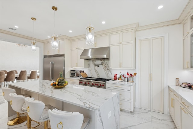 783 Oakleigh Rd, North Woodmere, NY 11581 - kitchen featuring under cabinet range hood, marble finish floor, a center island, visible vents, and premium appliances