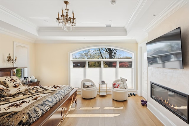 783 Oakleigh Rd, North Woodmere, NY 11581 - bedroom with light wood finished floors, multiple windows, and a tray ceiling