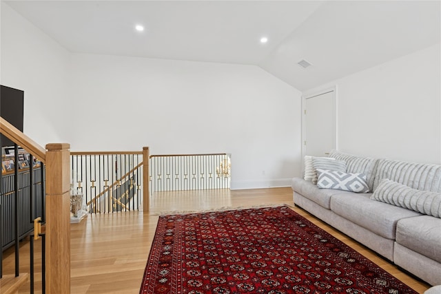 783 Oakleigh Rd, North Woodmere, NY 11581 - living area featuring recessed lighting, wood finished floors, visible vents, baseboards, and lofted ceiling
