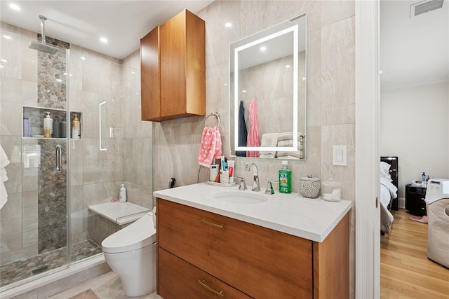 783 Oakleigh Rd, North Woodmere, NY 11581 - ensuite bathroom with toilet, tile walls, visible vents, and a stall shower