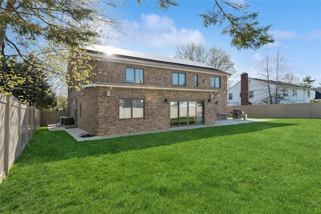 783 Oakleigh Rd, North Woodmere, NY 11581 - rear view of house with a patio, a yard, a fenced backyard, and brick siding
