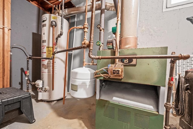 utility room featuring water heater