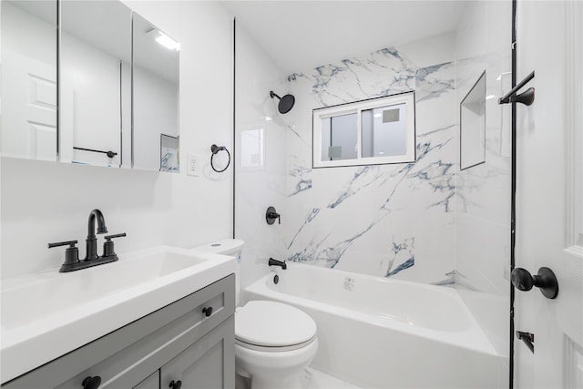 bathroom featuring toilet, vanity, and washtub / shower combination