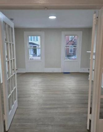 185 Mill St, Poughkeepsie, NY 12601 - empty room with wood finished floors and recessed lighting