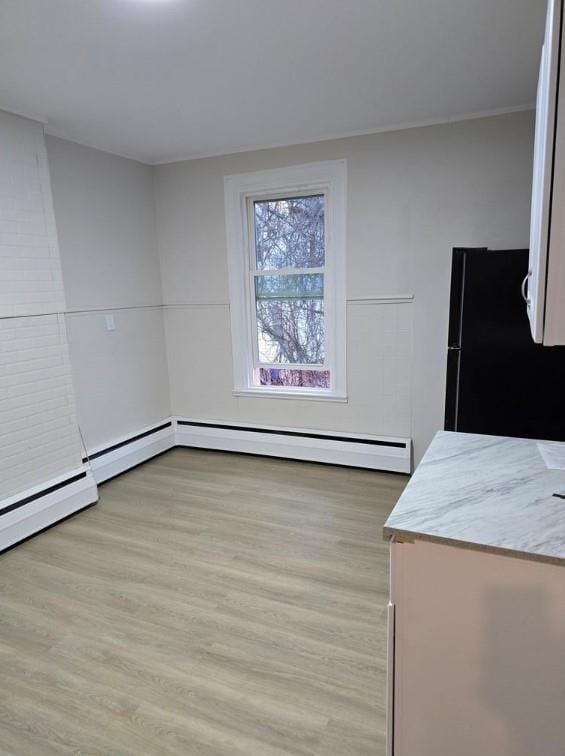 185 Mill St, Poughkeepsie, NY 12601 - unfurnished dining area with light wood-type flooring