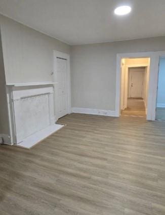 185 Mill St, Poughkeepsie, NY 12601 - spare room featuring wood finished floors