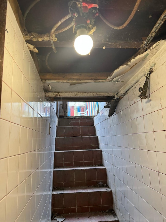 1242 Saint Lawrence Ave, Bronx, NY 10472 - staircase featuring tile walls