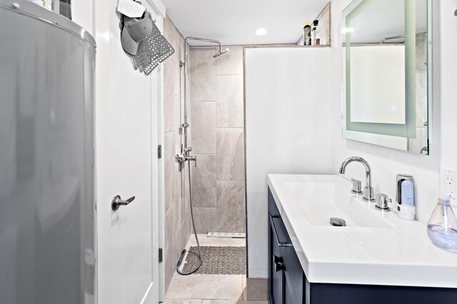 4 Evelyn Ct, Westhampton, NY 11978 - full bathroom with vanity, a tile shower, and recessed lighting