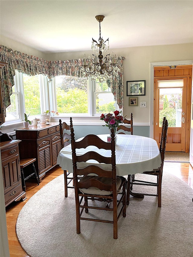 43 Glenwood Rd, New City, NY 10956 - dining space with a chandelier and light wood-style flooring