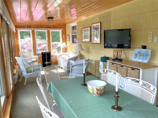 43 Glenwood Rd, New City, NY 10956 - dining area featuring carpet flooring, wood ceiling, and wood walls