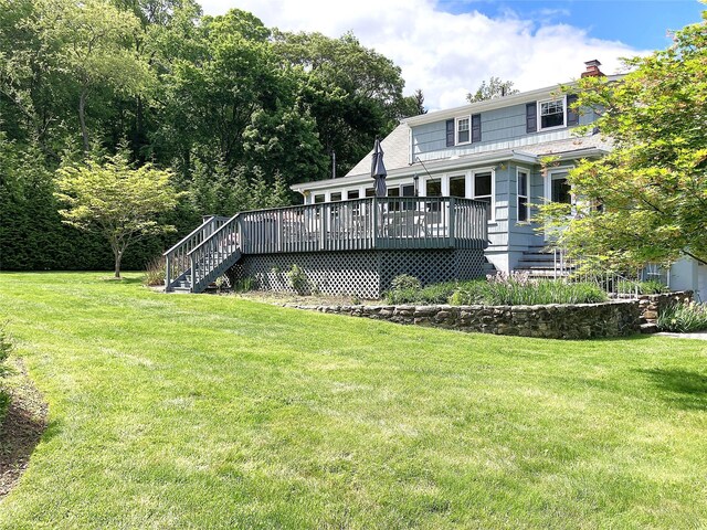 43 Glenwood Rd, New City, NY 10956 - rear view of property featuring a deck, a lawn, stairs, and a chimney