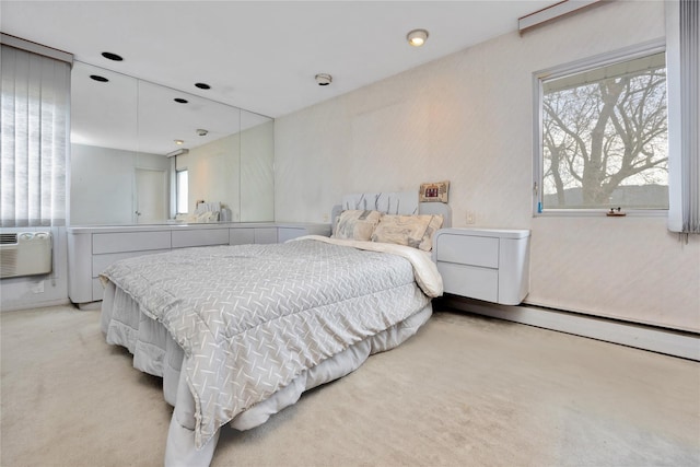9 Ensign Dr, Massapequa, NY 11758 - bedroom with a baseboard heating unit and light carpet
