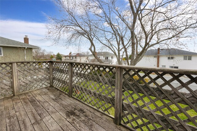 9 Ensign Dr, Massapequa, NY 11758 - wooden terrace featuring a residential view