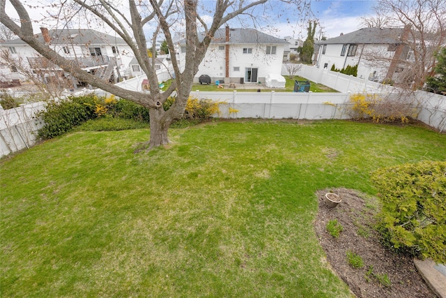 9 Ensign Dr, Massapequa, NY 11758 - view of yard featuring a fenced backyard and a residential view