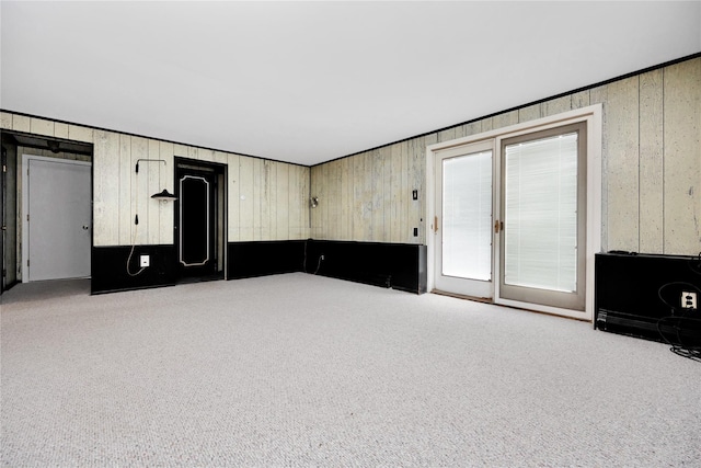 9 Ensign Dr, Massapequa, NY 11758 - unfurnished living room featuring wooden walls and carpet flooring