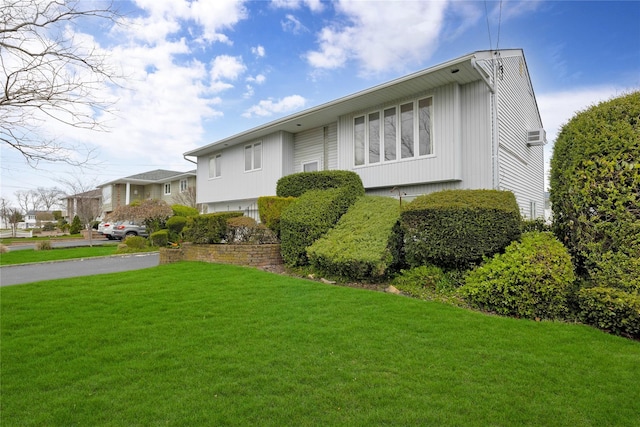 9 Ensign Dr, Massapequa, NY 11758 - view of front of house featuring a front lawn