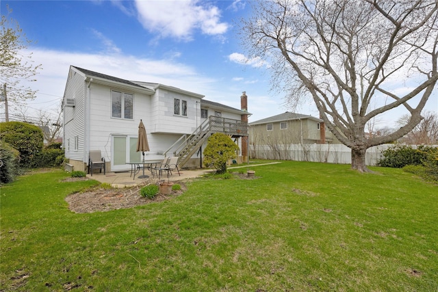 9 Ensign Dr, Massapequa, NY 11758 - rear view of property with stairway, a patio area, a lawn, and a wooden deck