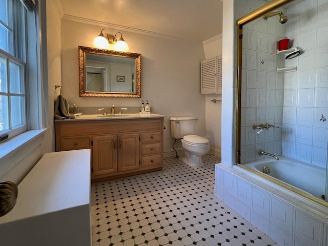 62 Shore Rd, Bayville, NY 11709 - bathroom with crown molding, toilet, vanity, tiled shower / bath combo, and baseboards