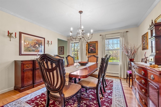 dining room featuring light wood-type flooring, a notable chandelier, ornamental molding, and a baseboard radiator