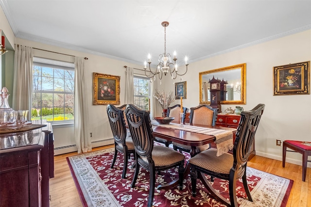 dining room with ornamental molding, a chandelier, plenty of natural light, and light wood-style flooring