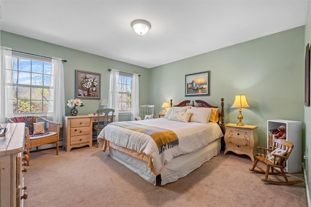 bedroom featuring light colored carpet