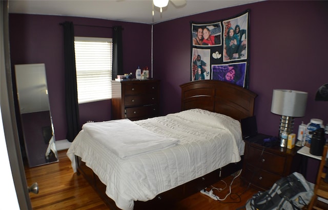 bedroom with ceiling fan and wood finished floors