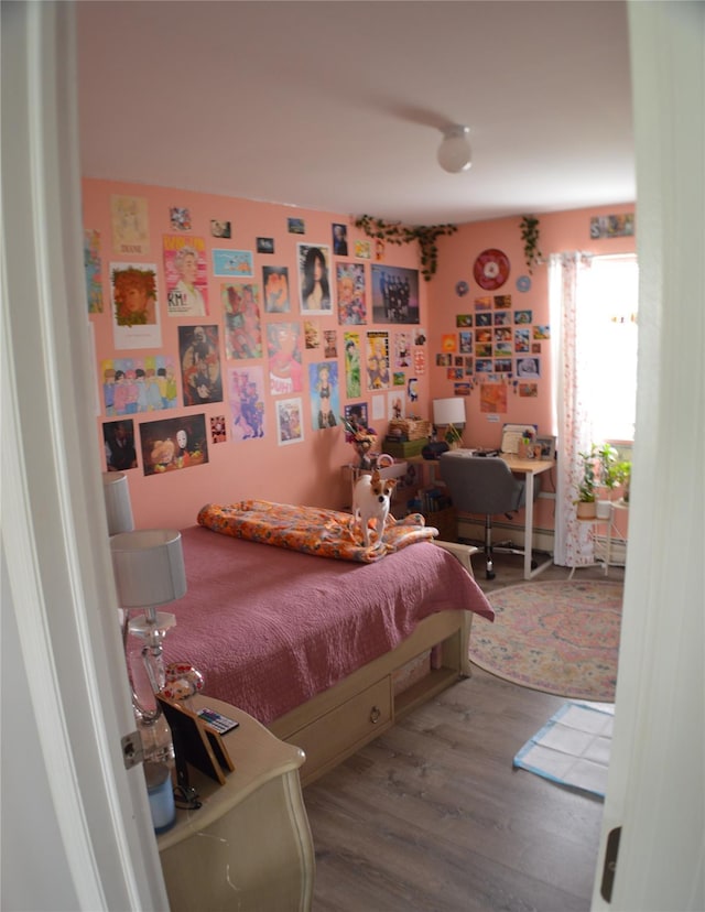 bedroom featuring wood finished floors