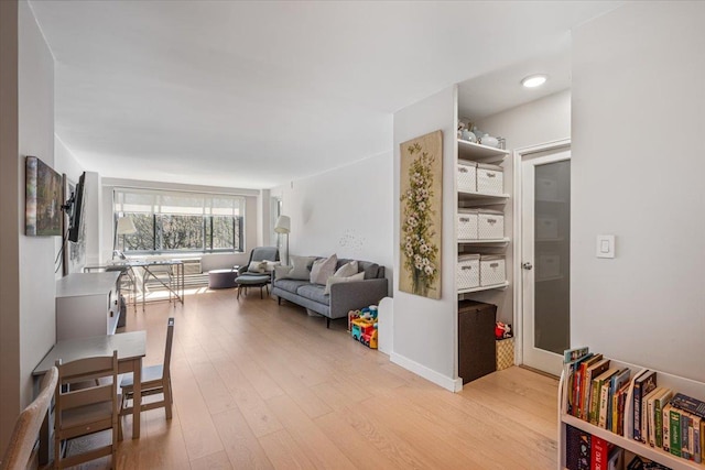 220-55 46th Ave Unit 3U, Bayside, NY 11361 - living room with light wood-style floors and baseboards