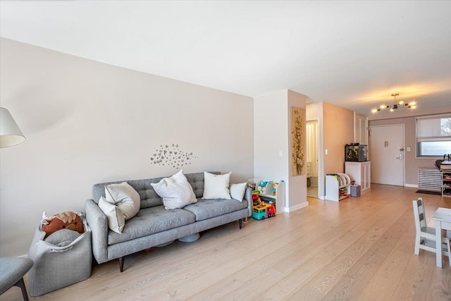 220-55 46th Ave Unit 3U, Bayside, NY 11361 - living room with baseboards and light wood-style floors
